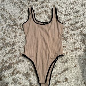 Ribbed tan bodysuit with black detailing